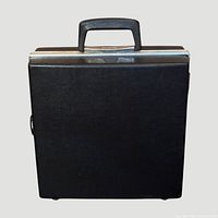 Front view of black faux leather briefcase showing handle and silver trim