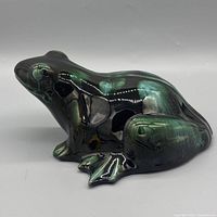 Front-left view of ceramic frog showing glaze coloration and form