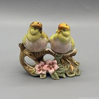 Front view of bird salt and pepper shakers on branch base