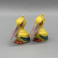 Front view of both ceramic bird shakers
