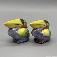 Front three-quarter view of both toucan shakers