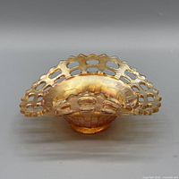 Front view of candy dish showing reticulated rim and marigold iridescence