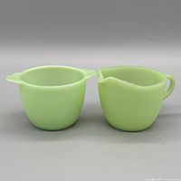 Both jadeite pieces side by side showing color, shape and size relationship
