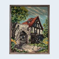 Front view of framed needlepoint art showing entire image and frame