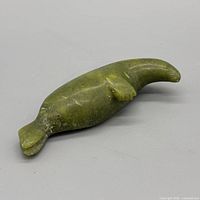 Top view of green soapstone manatee showing overall form and color