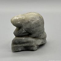 Right side profile of soapstone beaver on stone base