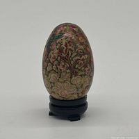 Front view of floral papier-mâché egg