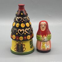 Front view of both nesting dolls showing size and painted details
