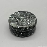 Top view of lid showing wolf and moon engraving