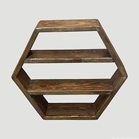 Front view of hexagon shelf with three shelves visible