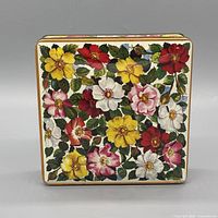 Front view of floral biscuit tin