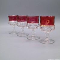 Four Indiana Glass Kings Crown cordial glasses angled side view