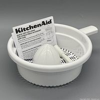 Full kit in basket showing reamer cone, adapter shaft and instruction manual