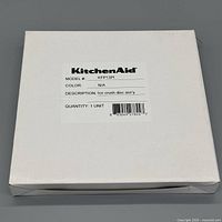 Labeled KitchenAid box showing model KFP13PI and description Ice crush disc ass'y