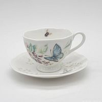 Teacup on saucer displaying Butterfly Meadow pattern