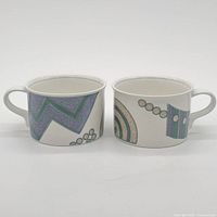 Front view of both handled bowls showing complete pattern