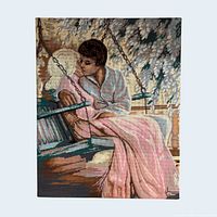 Front view of full needlepoint showing couple on swing