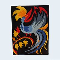 Front view of completed needlepoint showing design and colours