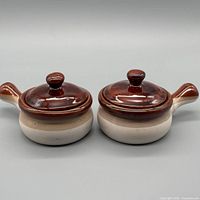 Pair of ceramic mini cocottes front view with lids on