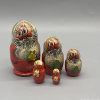 Front view of all five Santa nesting dolls