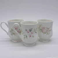 Front view of three fine bone china mugs