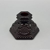 front view ruby red glass candle holder