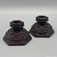 Both candlestick holders front angle