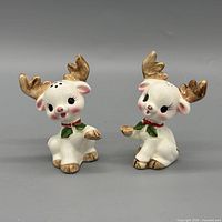 Front view of both ceramic reindeer shakers