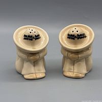 Front view of both ceramic shakers showing South of the Border text
