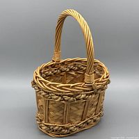 Basket front showing woven body and handle