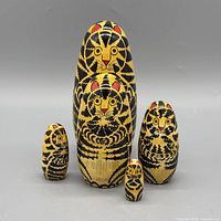 Front view of all five tiger nesting dolls