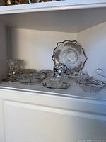 All 10 silver overlay glass pieces displayed on shelf