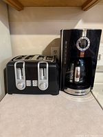 Toaster and coffee maker on countertop side-by-side