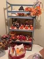 Shelving unit displaying autumn decor items