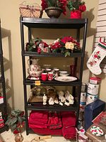 Full shelving unit showing majority of Christmas decor lot