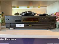 Front view of Panasonic DVD player showing display, controls and overall condition