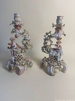 Pair of Dresden style porcelain candle holders front view