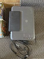 Top view of HP Deskjet 1050 printer with cables