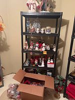 Full shelving unit showing majority of items and open ornament box