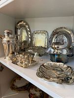 Full view of silver plate items on shelf