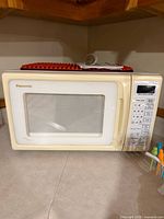 Front view of Panasonic microwave showing door and control panel