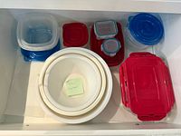 Drawer view showing entire assortment of containers, lids and mixing bowls