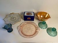 Group view of all glass pieces and tin
