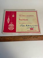 Cardboard presentation box lid with title and ruler for scale