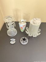 Overview of all six glass decor items on tabletop