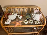 All items arranged on glass shelf showing overall lot