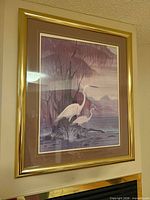 Full view of framed stork print on wall