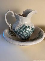 Pitcher inside matching wash basin showing overall style and pattern
