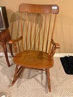 Front view of wooden rocking chair