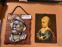 Both art pieces side by side in box for overall view
